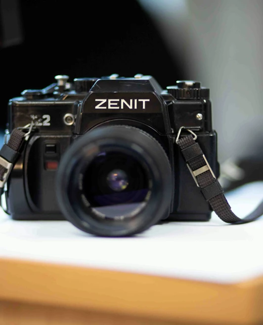 Vintage Zenit film camera placed on a desk, captured in a shallow depth of field. Vintage Zenit film camera placed on a desk, captured in a shallow depth of field.